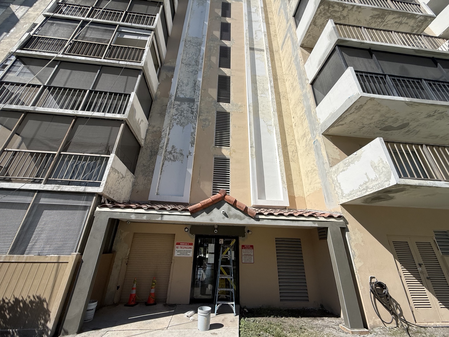 Actual exterior restoration work, with concrete balconies and prepared wall surfaces